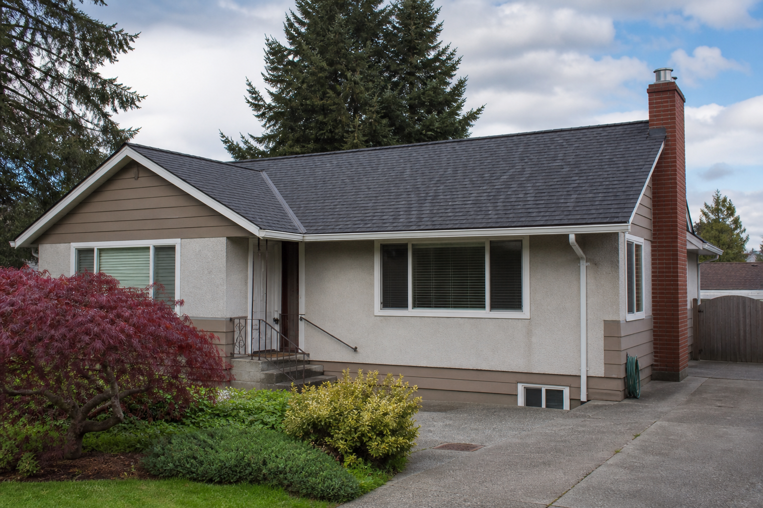 Craftsman bungalow with a newly installed dark charcoal architectural asphalt shingle roof
