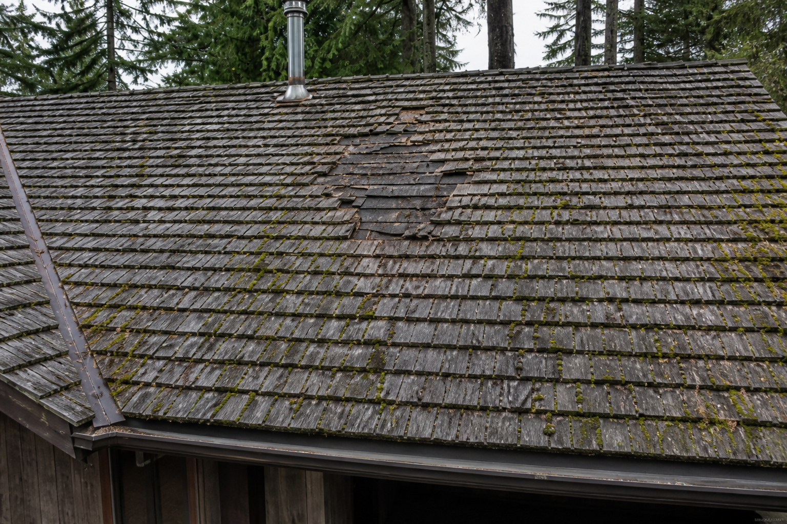 Tight technical failure detail before work on a roofing scenario typical of North Vancouver post-and-beam homes