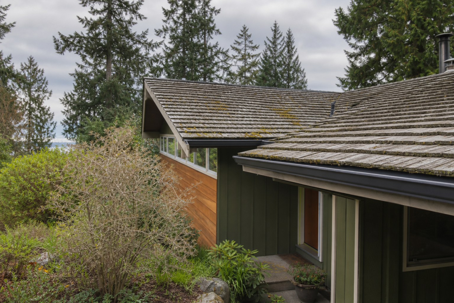 Eave, gutter, or secondary consequence detail before work on a roofing scenario typical of West Vancouver mid-century homes