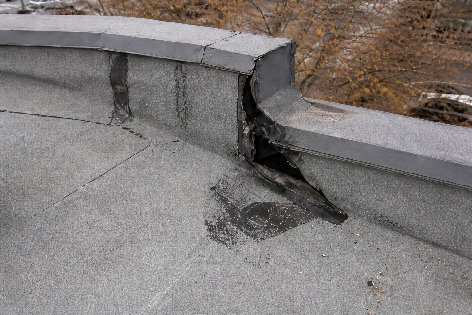 Eave, gutter, or secondary consequence detail before work on a roofing scenario typical of Burnaby commercial/strata roofs