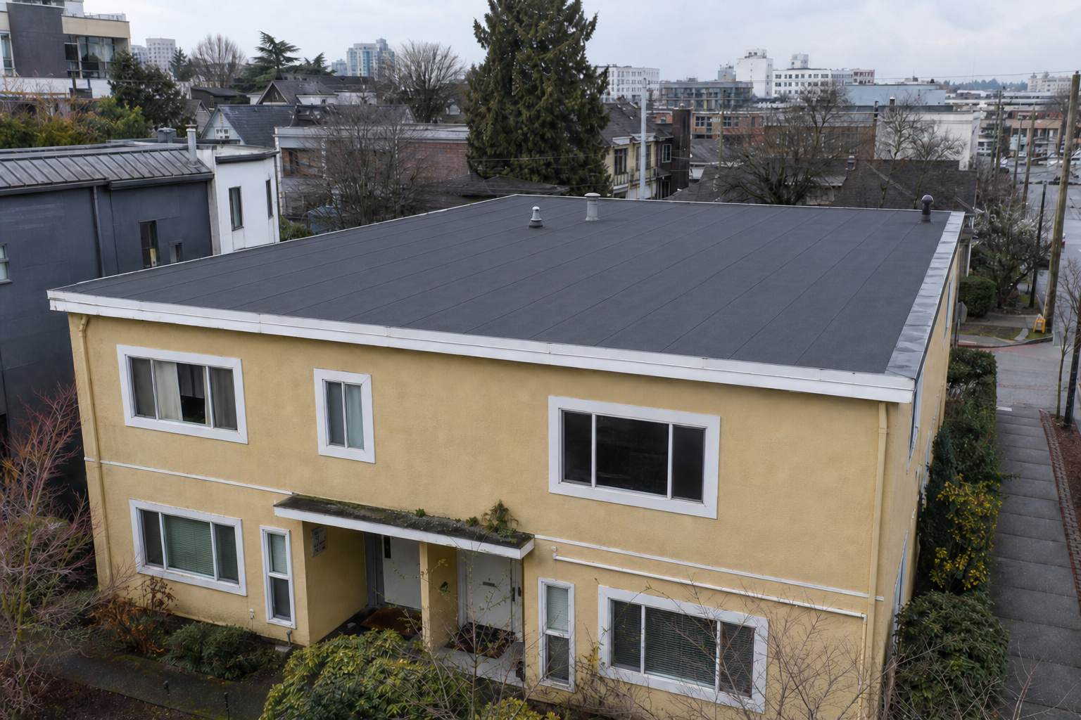 Matching repair or completion detail after work on a roofing scenario typical of Vancouver Mount Pleasant duplexes
