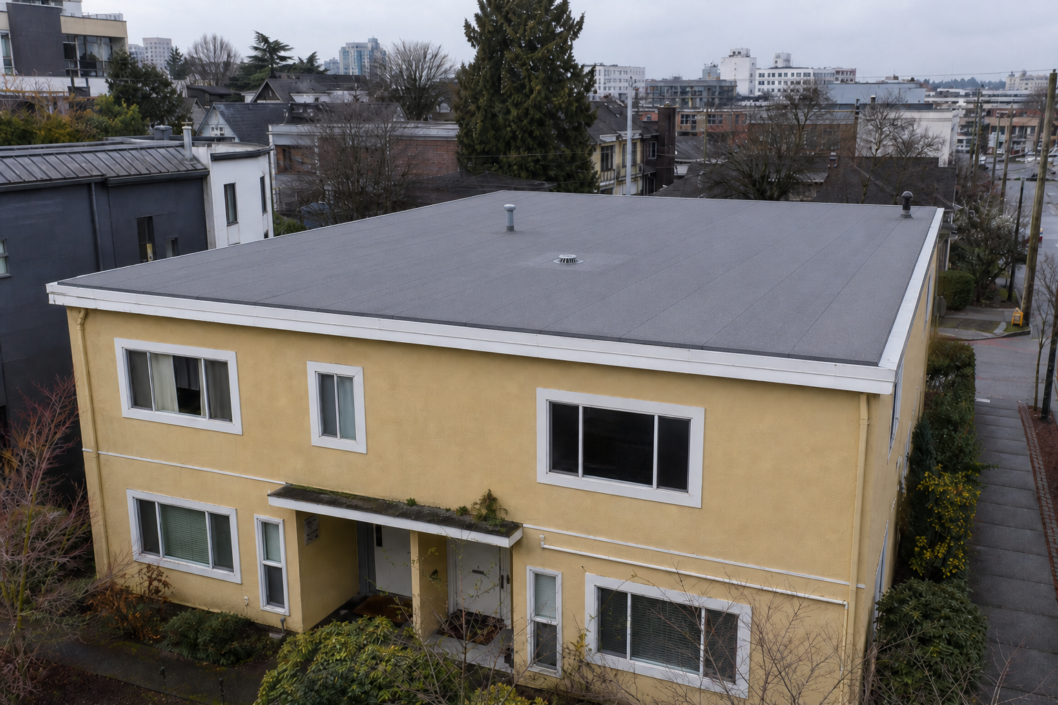 Matching technical detail after work on a roofing scenario typical of Vancouver Mount Pleasant duplexes