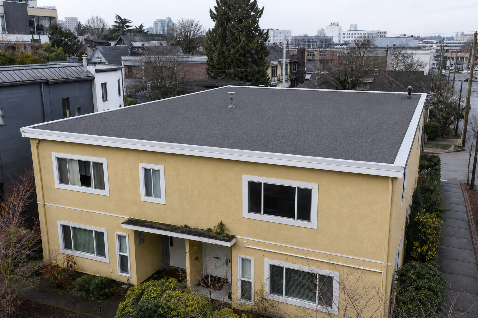 Matching alternate angle after work on a roofing scenario typical of Vancouver Mount Pleasant duplexes