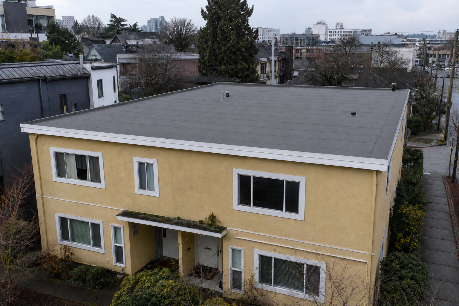 Matching eave or secondary detail after work on a roofing scenario typical of Vancouver Mount Pleasant duplexes