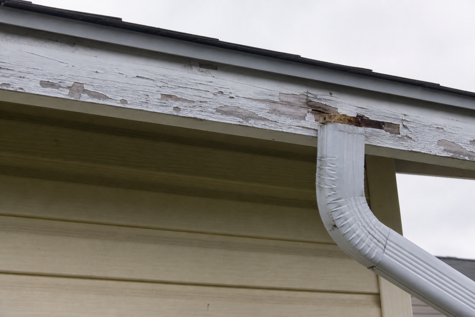 Eave, gutter, or secondary consequence detail before work on a roofing scenario typical of Delta 1980s homes