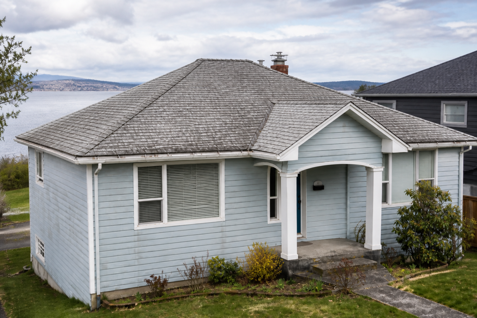 Alternate angle of the failure before work on a roofing scenario typical of White Rock coastal homes