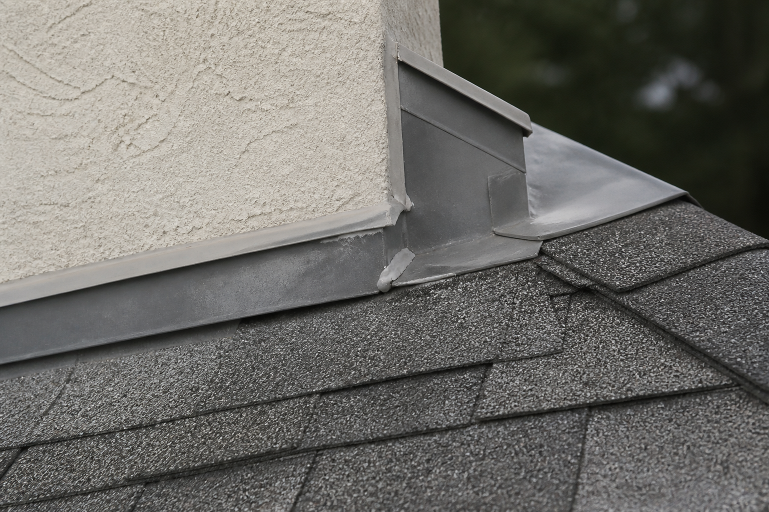 Eave, gutter, or secondary consequence detail before work on a roofing scenario typical of Langley cream-stucco homes