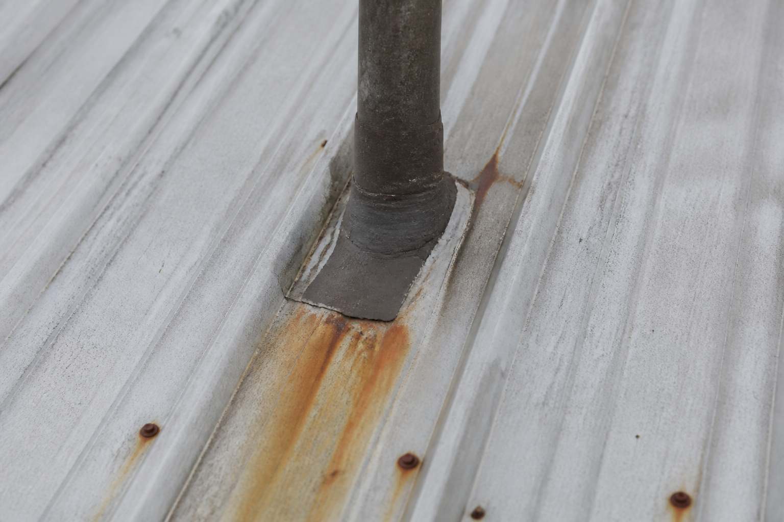 Tight technical failure detail before work on a roofing scenario typical of Langley acreage farmhouses