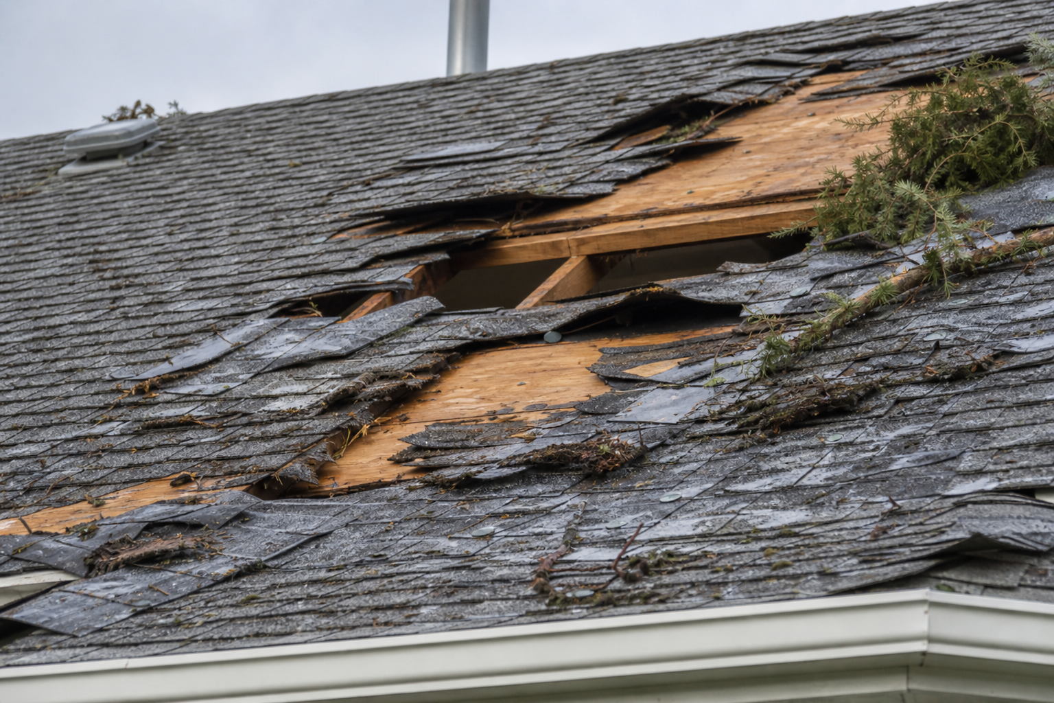 Eave, gutter, or secondary consequence detail before work on a roofing scenario typical of Surrey storm-damaged homes